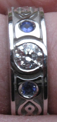 White gold, diamond and two tanzanites with celtic knot inlay White gold, diamond and two tanzanites with celtic knot inlay